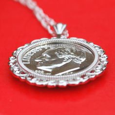 "You are looking at a gorgeous solid 925 sterling silver necklace with an authentic US 1961 Roosevelt dime 90% silver BU Uncirculated Proof coin. The coin is set with backside 4-prong. The pendant is made of solid 925 sterling silver, sized about 29mm(1.16\") x 23mm(0.92\"). It comes with a 18\" solid 925 sterling silver chain, and also a gift box. I hope you end up with one of these beautiful coin necklaces. This necklace will be great for gift, investment purpose or just adding to your coin/je Classic Jewelry For Commemoration With Round Pendant, Classic Round Pendant Necklace Nickel Free, Nickel-free White Gold Classic Necklaces, Nickel-free Classic White Gold Necklaces, Nickel-free White Gold Classic Necklace, Classic White Gold Necklace Nickel-free, Classic White Gold Nickel-free Necklace, Classic Stamped 925 Medallion Jewelry, Classic White Gold Necklace Stamped 925