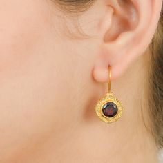 Garnet Vermeil 14K Gold Over Sterling Silver Earring 925 Silver = 4.30 gm. Garnet = 5.00 ct. Garnet is the birthstone for January and is a symbol of friendship. The beautiful earring measures to be 1.10 inches long including the wire and 0.60 inches wide at its maximum points. The earrings have been made by a team of highly trained and skilled artisans. What is Vermeil 14K Gold? It is a thick layer of 14K Gold plating on 925 Sterling Silver. If for any reason you are not completely satisfied, yo Gold Earrings With Round Stone For Anniversary, Classic Gemstone Earrings Perfect As Gifts, Classic Gemstone Earrings As Gift, Classic Gemstone Earrings For Gift, Gift Yellow Gold Jewelry With Lever Back Ear Wires, Round Birthstone Earrings For Her, Round Birthstone Earrings Gift For Her, Birthstone Earrings As Gift For Her, Gold Birthstone Round Earrings