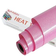 a roll of pink heat paper sitting on top of a box