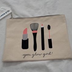 a bag with three makeup brushes on it and the words you go girl written in black ink