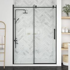 a bathroom with white walls and black trimmings on the shower door, toiletries and shelving