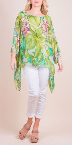 100% Silk Kaftan Style Blouse with Wildflower Botanical Print. Features 3/4 Length Sleeves and a Wavy Bottom. Exterior: 100% Silk Interior: 95% Viscose, 5% Elastic Fits Sizes XS- XL Made in Italy Chiffon Poncho, Poncho Design, Printed Chiffon Blouse, Kaftan Tops, Poncho Blouse, Kaftan Style, Silk Kaftan, Shirts Design, Style Blouse