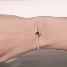 Product Details Make a stunning impression on your lady with this Minimal Solitaire Bracelet, adorned with a beautiful Princess Cut Ruby set in a durable Bezel Setting. The Solid Gold Chain Bracelet adds a touch of elegance to the overall design, making it a truly eye-catching and appealing piece of jewelry. Perfect for those born in July, this Ruby Chain Bracelet is an ideal birthday gift that is sure to be treasured for years to come. With its sophisticated design and brilliant sparkle, its th Solitaire Bracelet, July Born, Solid Gold Chains, Yellow Gold Bracelet, Gold Bracelet Chain, Princess Cut, Chain Bracelet, Gold Chains, Ruby