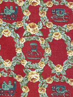 a red fabric with yellow flowers and train on it