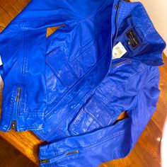 Brand New Electric Blue Leather Jacket. Bought From Lucky Store A Couple Years Ago Because I Thought It Was Super Cute And I Could Eventually Fit In It, But It’s Too Small For Me. Offers Welcome! Fitted Blue Leather Jacket With Pockets, Casual Blue Leather Jacket With Zipper Closure, Trendy Blue Leather Jacket With Zipper Closure, Trendy Blue Leather Jacket With Zipper, Blue Trendy Leather Jacket For Spring, Winter Blue Leather Jacket With Pockets, Blue Biker Jacket With Pockets And Long Sleeves, Casual Blue Leather Jacket With Long Sleeves, Blue Casual Leather Jacket