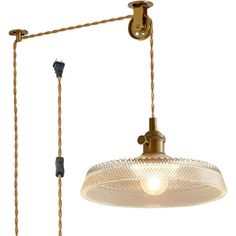 an old fashioned light hanging from the ceiling with two lights on each side and a cord attached to it