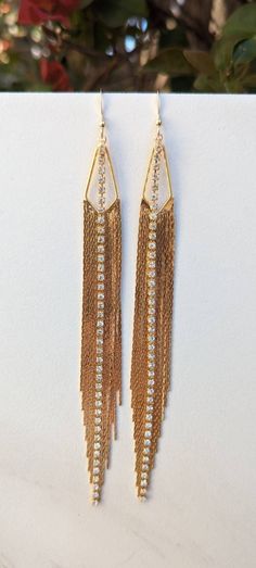 ONE OF A KIND Gold Fringe Earrings - Long Gold Tassel Earrings - Statement Earrings - Rhinestone Chain - Triangle Shaped Gold Jewelry - Xtra Long Fringe - Boho Dangle Gold filled ear wires Stylish, fun, stunning earrings.  Perfect for Vegas, New Years celebrations or a night on the town.  You can wear these lightweight beauties with a vintage tee and jeans or a little black party dress.  Rhinestone chain is made from solid brass, a naturally hypo-allergenic metal, which is electroplated nickel-free.  Tassel - 125x13mm Evening Latkans Drop Earrings, Elegant Metal Earrings With Rhinestone Fringe, Formal Dangle Jewelry With Rhinestone Fringe, Gold Earrings With Rhinestone Fringe For Evening, Gold Rhinestone Tassel Dangle Earrings, Gold Tassel Dangle Earrings With Rhinestones, Elegant Dangle Rhinestone Fringe Jewelry, Gold Chandelier Earrings With Rhinestone Fringe For Evening, Elegant Gold Earrings With Rhinestone Fringe