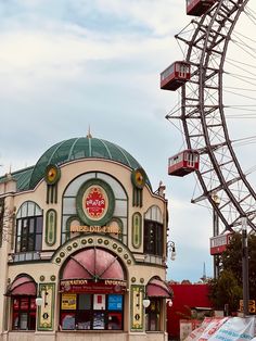 an amusement park with a ferris wheel in the background