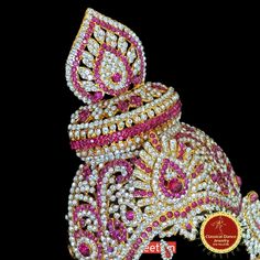 Design by Classical Dance Jewelry® ❥ Product Details: Designer white and pink stones decorated Goddess Varalakshmi ganesha kireetam crown ❥ Material is Brass alloys ❥ Color: Gold, white stone ❥ Beautiful Goddess Lakshmi face set used for varalakshmi Vratham ❥ Beautifully embossed mask used for pooja during Varalakshmi Vratham ❥ Beautifully decorated mask used for pooja during Varalakshmi Vratham ❥ Completely Decorated with High Quality Stones and pearls 🎈We will send item that are in stock clos White Temple Jewelry Tikka With Zari Work, White Zari Work Temple Jewelry Tikka, Ceremonial Stone Work Tikka For Festivals, Ceremonial Festival Tikka With Stone Work, Ceremonial Traditional Wear With Stone Work For Diwali, Traditional Heavy Pink Tikka, Navratri Traditional Wear With Stone Work, Pink Traditional Wear With Tilla For Puja, Heavy White Traditional Wear