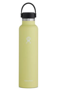 the hydro flask water bottle is shown in light yellow with black lid and stainless steel spout