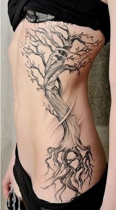 a woman with a tree tattoo on her stomach is shown in black and grey colors