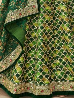 Look stunningly beautiful in this enticing green color lehenga made of art silk material embellished with thread embroidery, sequins work, dori work, and lace border work. This gorgeous green color lehenga comes with a similar color blouse designed with sequins and dori work featured with a similar color organza dupatta with floral printed and lace border work. This lovely green engagement wear lehenga is semi-stitched can fit up to 42 inches and comes with fully unstitched choli material. The l Green Chanderi Set For Reception, Designer Green Dupatta For Transitional Season, Semi-stitched Anarkali Lehenga With Meenakari, Green Embroidered Sharara, Designer Green Anarkali Set For Navratri, Green Anarkali Set For Navratri Designer Wear, Green Sets With Zari Work For Reception, Transitional Green Saree With Resham Embroidery, Green Silk Sets For Reception