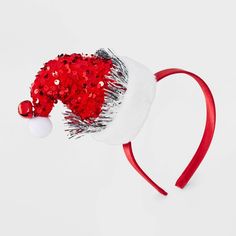 The Girls' Sequins Santa Hat Headband by Cat & Jack™ Red adds a festive sparkle to any holiday outfit. Featuring a cute Santa hat design covered in shimmering sequins, this headband is perfect for Christmas parties, school events or family gatherings. Made from soft, lightweight material, it provides a comfortable fit. Fun and festive, this headband is a must-have accessory to spread holiday cheer and complete any Christmas look. Cat & Jack™ - Designed for all children so you can trust it's made Red Adjustable Mini Hat For Christmas, Adjustable Red Mini Hat For Christmas, Adjustable Red Mini Hat For Holidays, Adjustable Red Mini Christmas Hats, Festive Red Adjustable Hat, Adjustable Red Hat For Festive Occasions, Red Adjustable Festive Hat, Christmas Party Adjustable Hair Accessories, Adjustable Headband For Holiday Festivities