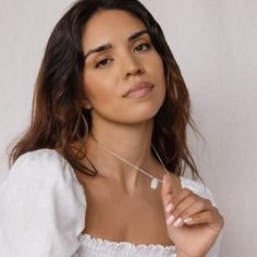 Our engraved Ribbed Flower Tag Necklace is a step up from the typical charm necklace. With a ribbed texture around the rectangle pendant and a unique sparkly twist chain, this vintage inspired necklace easily elevates your personal everyday style. Material: High Quality Solid 925 Sterling Silver Finish: Sterling Silver ∙ 18K Gold ∙ Rose Gold Featuring ~15mm x 10mm Ribbed Rectangular Pendant on a Singapore Twist Chain The engraving can be created with or without ink. The default design comes with Everyday Necklace With Delicate Chain And Rectangular Pendant, Everyday Rectangular Pendant Necklace With Delicate Chain, Delicate Everyday Necklace With Rectangular Pendant, Delicate Rectangular Pendant Necklace For Everyday, Dainty Necklace With Delicate Chain And Rectangular Pendant, Delicate Chain Sterling Silver Necklace With Rectangular Pendant, Everyday Charm Necklace With Delicate Rectangular Pendant, Sterling Silver Necklace With Delicate Chain And Rectangular Pendant, Elegant Charm Necklace With Rectangular Pendant