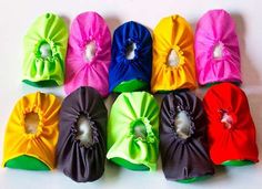 six different colored hair ties with bows on them