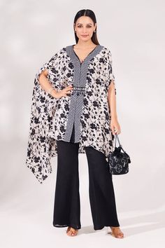 Black, white kaftan with floral vine print and embellished with zircon, cutdana, sequins and beads embroidery. Paired with palazzo and matching bag. - Aza Fashions Bohemian Floral Print Evening Kaftan, Elegant Printed V-neck Kaftan, Elegant Flowy Printed Kaftan, Elegant Black Kaftan With Floral Print, Elegant White Kaftan With Kimono Sleeves, Chic White Kaftan With Kimono Sleeves, Elegant Floral Print Flowy Kaftan, Elegant Tunic Kaftan For Spring, Elegant Printed Kaftan For Spring