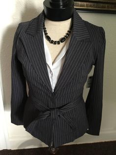 "90's Vintage Gray Pink Pinstripes Denim \"Bisou Bisou\" Jacket \"NWT\", large collar, plunging  v-neck, button closure, and self belt. New With Tag: Bisou Bisou Good vintage condition. New with tags. Size: 6 Measurements: Shoulders: 15 1/2\" Bust: 31\" Length: 24\" Sleeve: 24\"" Fitted Blazer With Vertical Stripes And Long Sleeves, Fitted Long Sleeve Blazer With Vertical Stripes, Striped Long Sleeve Blazer With Button Closure, Pinstripe Fitted Blazer With Button Closure, Fitted Pinstripe Outerwear For Office, Fitted Pinstripe Blazer With Button Closure, Fitted Pinstripe Outerwear For The Office, Spring Fitted Blazer With Vertical Stripes, Fitted Spring Blazer With Vertical Stripes