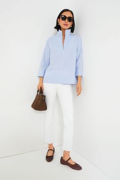 Your staple style gets a fresh update with the Sullivan Blouse. Made from a lightweight and crisp cotton material that provides effortless polish with a classic blue pinstripe print that pairs well with all kinds of neutrals, this stand collared shirt is a must-have in any closet. Style it with denim and sneakers for off-duty weekend wear, under a cardigan with boots when the temps drop, or with a sweet skirt and ballet flats for feminine flair. Stand collar V-neckline Bracelet length sleeves wi Stand Collar Blouse, Stand Collar Shirt, Blouse Sale, Plus And Minus, Cocktail Attire, Weekend Wear, Collar Blouse, Collared Shirt, Office Fashion