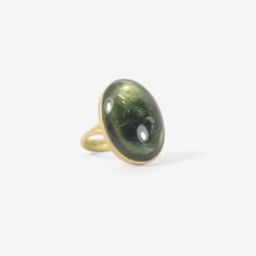 Details Lola Brooks 18k yellow gold & large oval green tourmaline ring, size 6 1/4. The 16.36ct stone measures approximately 7/8″ x 5/8″ & is set on top of an 18k yellow gold band that tapers from approximately 1/16″ to 1/8″. - green tourmaline, 16.36ct - 18k yellow gold - size 6 1/4 Sizing This ring can be resized. Please allow 2 - 6 weeks. Inquire about sizing fee. Luxury Oval Green Dome Ring, Green Oval Dome Ring For Formal Occasions, Modern Green Oval Rings, Oval Tourmaline Emerald Ring In Yellow Gold, Gold Oval Tourmaline Ring, Green Oval Gemstone Dome Ring, Green Oval Sapphire Ring For Formal Occasions, Green Oval Cabochon Dome Ring, Green Oval Dome Ring With Polished Finish