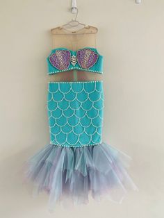 This sweet mermaid costume is perfect for any special occasion. It includes:  you can select only the dress or dress and accessories Handmade to order. No two items will be exactly the same!  All of my items are made with quality fabrics and professional finishes.  Sizing: Be sure to check out the measurement chart image in each product. It is usually the last image in the product listing. not sure which size to order? do you want me to have a specific measurement?  send measurements in your order hair accessories (if applicable), details and color may be different from the photo, if you have any questions please send message before order Processing time is 4 weeks  Free Shipping 5 /7 days Express Shipping available in listings ($20) Option to rush order available in listings $20 (Processi Tulle Mermaid Dress With Ruffles, Fitted Mermaid Dress With Mermaid Hem For Pageant, Fitted Mermaid Dress For Pageant, Fitted Mermaid Dress For Pageants, Fitted Mermaid Dress For Costume Party, Fitted Mermaid Dress With Ruffles For Costume Party, Blue Tulle Mermaid Dress For Party, Blue Princess Mermaid Dress For Pageant, Princess Style Blue Mermaid Dress For Pageant