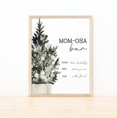 a christmas tree in a pot with the words mom - osa bar on it