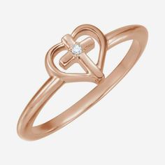 a rose gold ring with an open heart and a diamond in the middle, on a white background