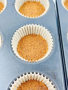 several muffin tins filled with cupcake batter and topped with crumbs