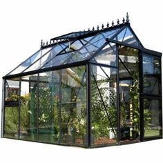 This Exaco Janssen Junior Victorian 23 Greenhouse Kit is a perfect for any yard. The Junior Victorian Greenhouse kit provides the ideal, year-round, gardening environment while exhibiting Old World Style and European engineering and craftsmanship. The elegant black aluminum framework, tempered glass panels, abundant 5 ft. side walls and 8 ft. 2 in. peak height combine to give you a beautiful greenhouse while providing you with 79 sq. ft. of comfortable interior workspace with a full view of your Greenhouse Frame, Victorian Greenhouse, Victorian Greenhouses, Conservatory Greenhouse, Commercial Greenhouse, Diy Greenhouse Plans, Best Greenhouse, Hobby Greenhouse, Walk In Greenhouse