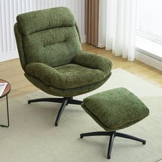 a green chair and footstool in a living room with a white rug on the floor