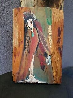 a wooden block with a painting on it