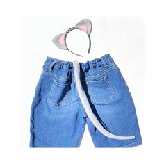 a pair of blue jeans with cat ears attached to the front and back of it