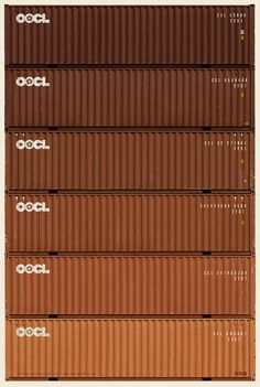 a stack of brown shipping containers sitting on top of each other