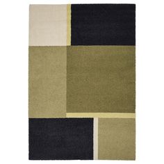 an area rug with different colors and shapes on the floor, including black, green, beige