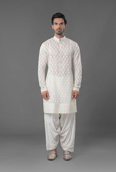 Ivory Color Embroidered Sherwani Festive White Salwar Kameez With Naqshi, Designer White Salwar Kameez With Naqshi Detailing, Designer White Salwar Kameez With Naqshi, White Salwar Kameez With Naqshi For Eid, Designer White Naqshi Salwar Kameez, White Naqshi Salwar Kameez For Eid, White Naqshi Sets For Festivals, White Naqshi Festival Sets, Festive White Lawn Suit With Naqshi