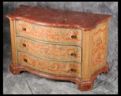 an old dresser has been painted with floral designs