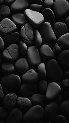 black and white photograph of rocks in the dark