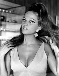 black and white photograph of a woman with her hair blowing in the wind, wearing a halter top