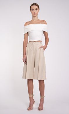 In the Lex Culotte, you'll find the perfect mix of comfort and style. These pleated shorts feature a relaxed fit, high-rise waist, and knee-length hemline. Versatile enough to be dressed up or down with a button down or tee, these culottes make a statement wherever you go. Products Display, Jumpsuit And Blazer, Easy Chic, Pleated Shorts, Touch Of Class, Sweater Sale, Romper Dress, Dress Romper, Active Wear Tops