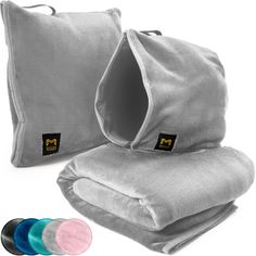 two pillows and one pillow are shown with the covers folded up to show their inner zippers