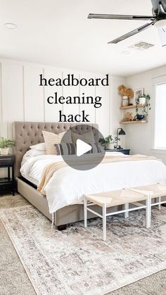 a bed room with a neatly made bed and a rug on the floor that says headboard cleaning hack