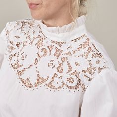 Introducing a women vintage white blouse that stands out with its high ruffled collar and back-button design. This long-sleeve shirt captivates with its embroidered detailing and matching ruffles at the sleeve hems, echoing the collar's design. Chic and lightweight, it's perfect for warm days and preppy ensembles. Though it doesn't have a composition tag, the fabric feels like cotton or a cotton blend, making it comfortable and breathable. MEASUREMENTS (while lying flat): Fits women size S - M A Vintage White Blouse, White Embroidered Blouse, Black Linen Pants, Shirt Elegant, Ruffled Tunic, Fits Women, Ruffled Collar, Wide Leg Linen Pants, Pantalon Large