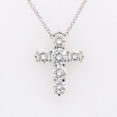 Forever One Moissanite Cross Necklace Gold Pendant Religious Symbol Christianity Six Stones The cross is one of the symbols, used by many religions, such as Christianity. In the end, the cross is the ultimate demonstration of God's power. Necklace is made of 14k white gold and contains shared prongs set forever one moissanites stones (1.75cttw). Cable, gold chain with lobster clasp is included with the price. We offer two different chain length: 16 inch and 18 inch. Dimensions: 19.5mm tall, 15mm White Diamond Spiritual Jewelry, Spiritual White Diamond Jewelry, Spiritual Diamond Necklace For Anniversary, Classic White Gold Diamond Necklace With Si Clarity, Classic White Gold Diamond Necklace Si Clarity, White Diamond Spiritual Necklace, White Diamond Spiritual Necklaces, Sterling Silver Cross Necklace With Vvs Clarity For Anniversary, Sterling Silver Cross Pendant Diamond Necklace For Anniversary