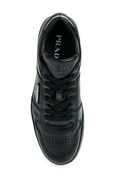 Three different versions of the iconic Prada logo brand this sporty sneaker done in supple leather and finished with a perforated toe for breathability. Lace-up style Removable insole Leather upper and lining/rubber sole Made in Italy Designer Shoes Modern High-top Sneakers With Logo For Sports, Leather Sneakers With Perforations For Sports, Luxury Perforated Sneakers For Sports, Sporty Calf Leather Sneakers, Designer Sports Sneakers With Studded Rubber Outsoles, Sporty Calf Leather Sneakers For Sports, Classic Calf Leather Sneakers With Logo, Classic High-top Sneakers With Perforations For Light Sports, Designer Streetwear Sneakers With Perforated Toe Box