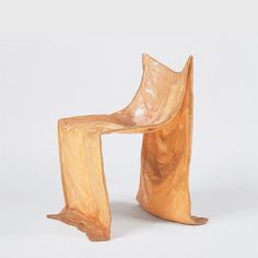 a wooden chair sitting on top of a white floor