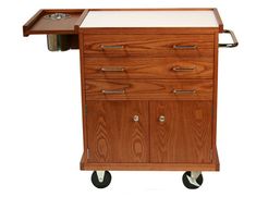 a small wooden cart with wheels and drawers