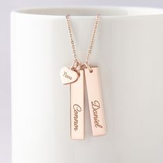 "This beautiful grandma necklace is engraved with your children's names on each charm. It's a perfect gift for your loved one with up to 5 personalized charms. PRODUCT INFO * Material: Solid 925 Sterling Silver * Dimensions: Bar charm measures ~ 1 1/4\" x 1/4\" (32 x 6.5mm). Heart charm measures ~3/8\"x5/16\" (9.5 x 8.2mm) * Word limits: 1 name/charm * By default, silver charm comes with BLACK engraving and gold-plated charm comes with CLEAR engraving HOW TO ORDER * Select your preferred finishi Customizable Rose Gold Charm Necklace For Gift, Customizable Rose Gold Charm Necklace As Gift, Personalized Rose Gold Necklaces For Mother's Day, Personalized Rose Gold Necklace For Mother's Day, Adjustable Rose Gold Name Necklace For Mother's Day, Personalized Rose Gold Name Necklace, Customizable Rose Gold Necklaces For Birthday Gift, Customizable Rose Gold Necklaces, Rose Gold Engraved Necklace For Gifts