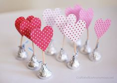 small heart shaped candy lollipops in pink and white polka dotty hearts