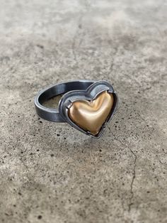 tiny 14k goldfill heart set with oxidized sterling silver. Available in sizes 5-12. If you need a custom size, please put in notes upon ordering. 1/2" *pieces are made to order. please note desired band size when ordering. Gold Heart-shaped Enamel Ring For Anniversary, Enamel Ring, Stone Jewelry, Heart Ring, Gold Rings, Handmade Jewelry, Sterling Silver, Band, Silver