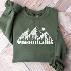 This Mountain Themed Sweatshirt is a perfect gift for all nature lovers who love the outdoors.  Also this Mountains Sweatshirt makes a perfect family vacation shirt.  Whether it's a gift for mom or dad, trail runners, cross country or hikers, they are sure to love it!   SUPER SOFT AND COZY CREWNECK SWEATSHIRTS AND HOODIES S H I R T / D E T A I L S Our sweatshirts are SUPER soft and SUPER comfy. For Women They Run Oversized! 50% Cotton/50% polyester and pre-shrunk.  We Use Soft and Cozy Gildan 18 Spring Outfits Mountains, Mountain Sweatshirt Design, Outdoor Long Sleeve Sweatshirt With Letter Print, Long Sleeve Sweatshirt With Letter Print For Outdoor, Long Sleeve Letter Print Sweatshirt For Outdoor, Hoodie Top For Outdoor Fall Activities, Fall Hoodie Top For Outdoor, Fall Outdoor Hoodie Tops, Hoodie Top For Outdoor Fall Events