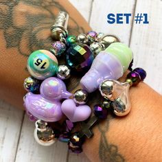 Meaningful cute fancy and fun beads bracelets. Set of 4. Positive vibes for empowered women. Fun Beaded Bracelets For Friendship, Trendy Crystal Bracelet With Colorful Beads, Trendy Charm Bracelet For Friendship With Colorful Beads, Trendy Colorful Beads Charm Bracelet For Friendship, Funky Beaded Bracelets For Gifts, Trendy Round Beaded Charm Bracelet For Friendship, Playful Stretch Bracelet For Friendship, Handmade Novelty Purple Bracelets, Funky Colorful Beads Bracelets For Gifts